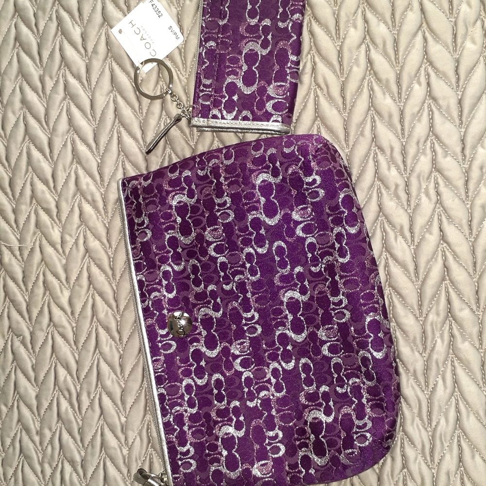 Coach purple wristlet and matching wallet.